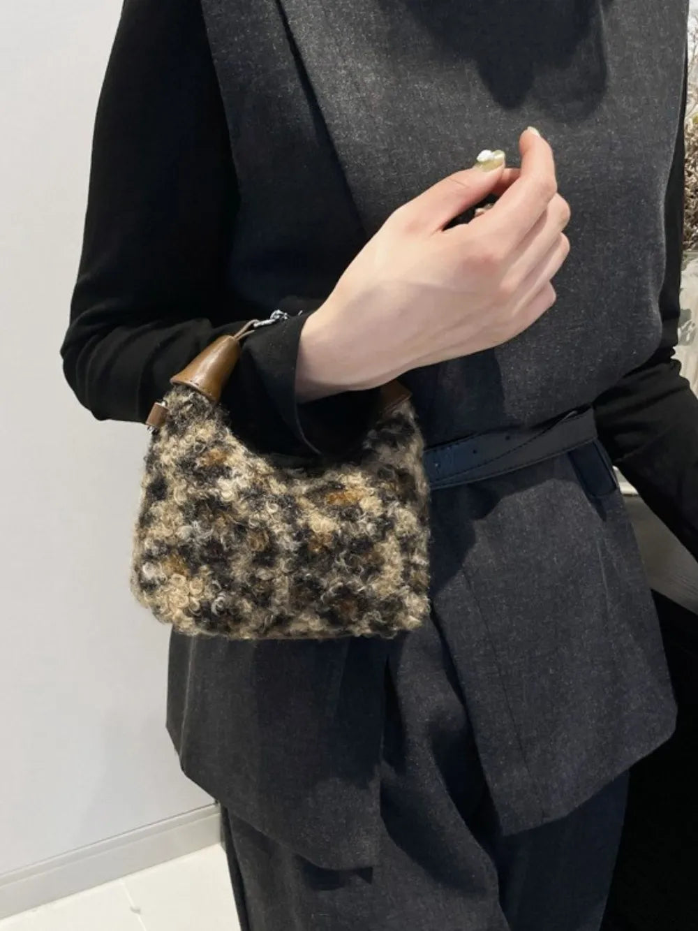 Shearling check mini shoulder bag with brown leather trim.