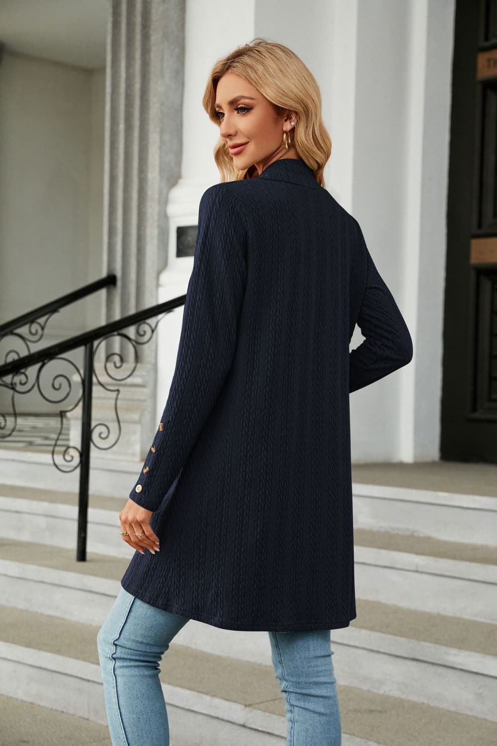 Dark Blue textured knit duster cardigan with gold button detail on sleeve cuff.
