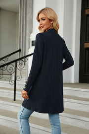 Dark Blue textured knit duster cardigan with gold button detail on sleeve cuff.
