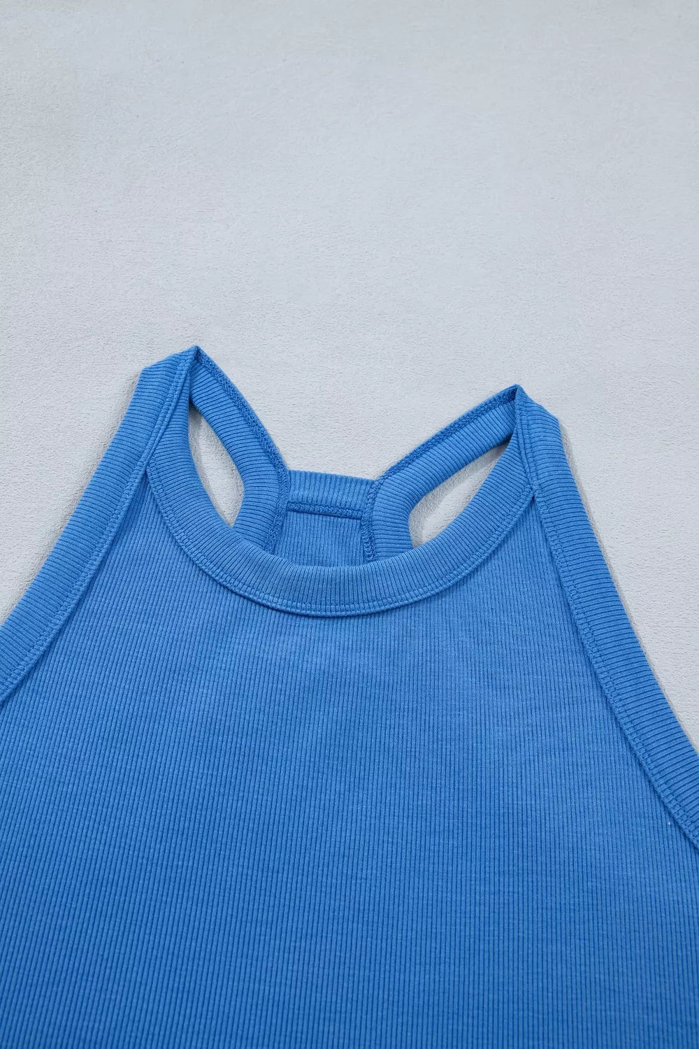 Blue ribbed cropped tank top with racerback detail