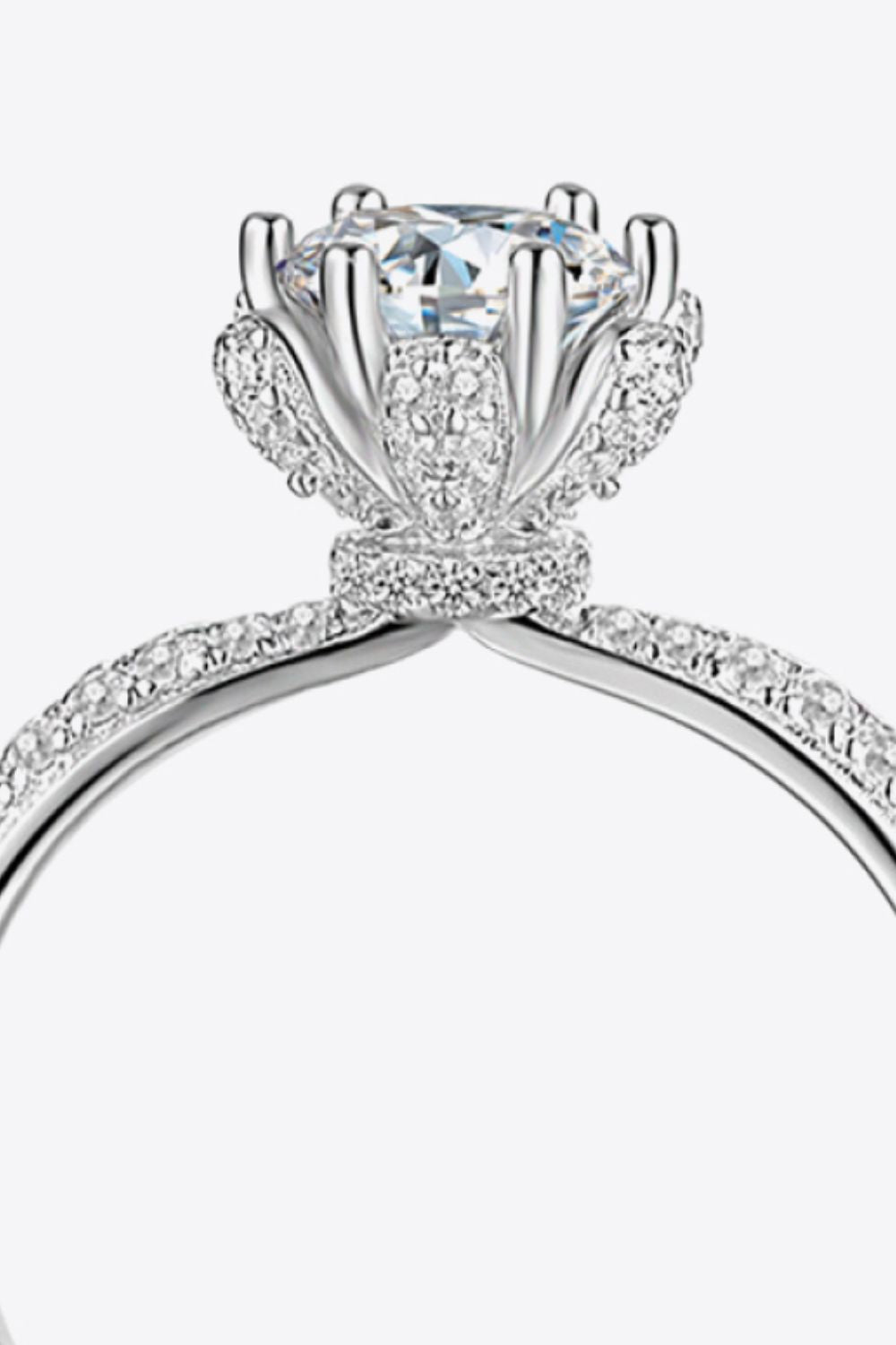 Silver halo ring with a large center stone and pave band