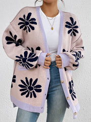 Floral jacquard knit cardigan in blush pink with navy flowers and lavender trim.