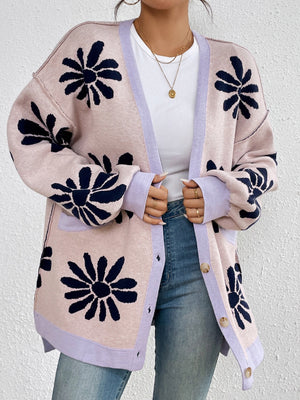 Floral jacquard knit cardigan in blush pink with navy flowers and lavender trim.