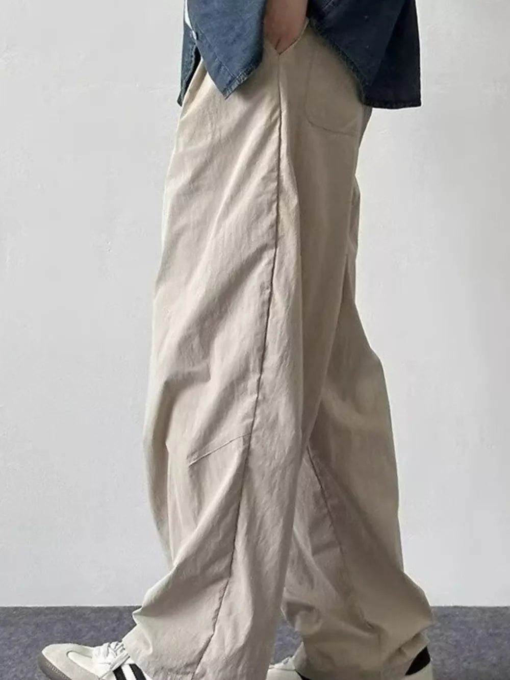 Relaxed fit khaki sweatpants with a drawstring waist and pockets.