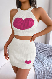 White knit halter crop top and mini skirt set with pink intarsia hearts.