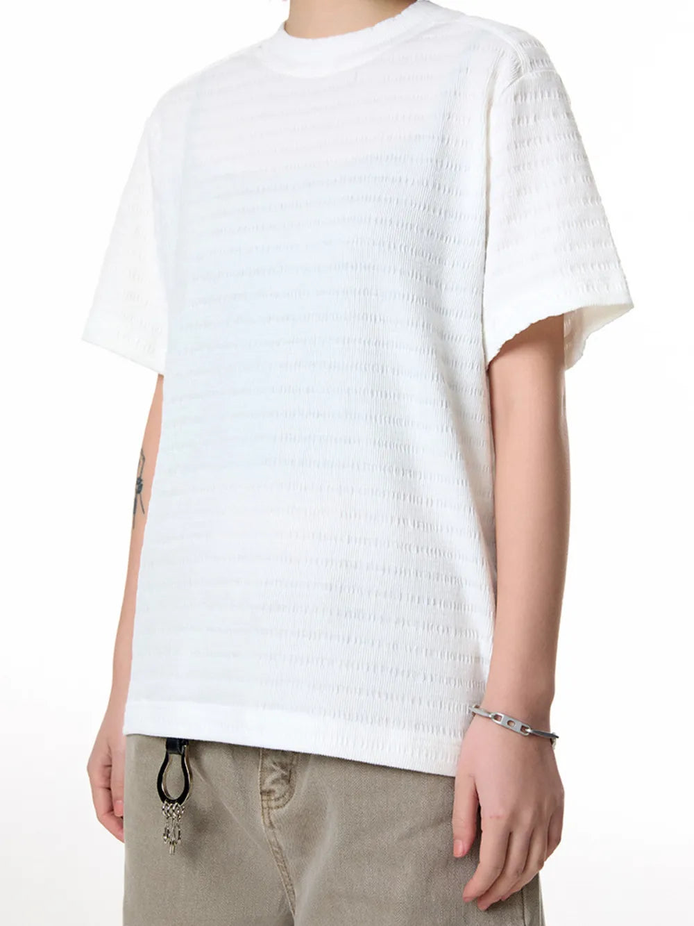 Men's white textured knit crew neck t-shirt with short sleeves.