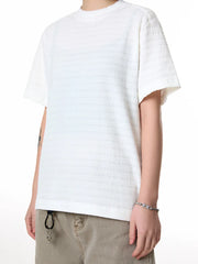Men's white textured knit crew neck t-shirt with short sleeves.