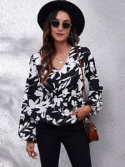 Black butterfly print peplum blouse with gathered waist and V-neck