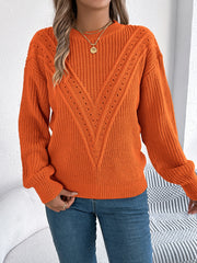 Orange chevron knit sweater with eyelet detail and crew neck.
