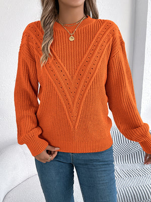 Orange chevron knit sweater with eyelet detail and crew neck.