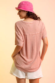 Relaxed waffle knit top in Pale Blush with short sleeves and V-neck detail.