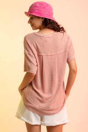 Relaxed waffle knit top in Pale Blush with short sleeves and V-neck detail.