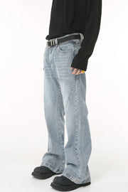 Flared denim jeans in medium wash with sculpted seam detail and bootcut leg.