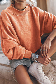 Acid wash mock neck sweatshirt in Sherbet with ribbed cuffs and neckline.