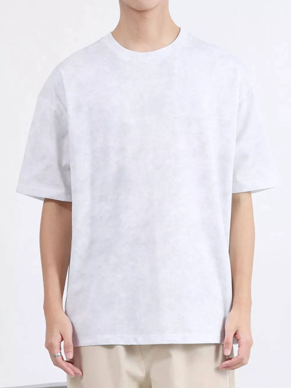 Men's white relaxed fit t-shirt with a subtle marbled texture.