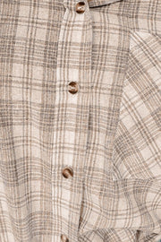 Plaid hooded shirt jacket in khaki cotton with button front and drawstring details.