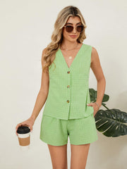 Green gingham linen vest and shorts set with button front and elastic waist shorts.