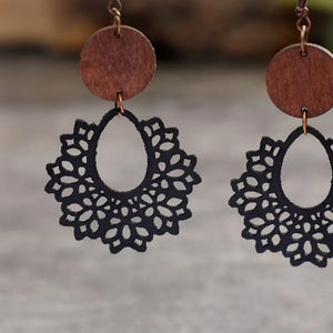Black floral laser-cut wooden drop earrings with a boho style