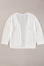 White open-knit crochet cardigan with long sleeves and a V-neck.