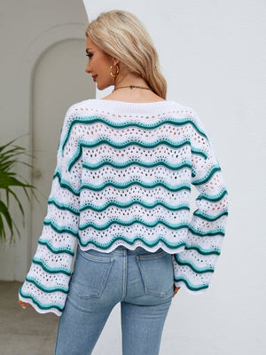 Scalloped crochet crop sweater with white and turquoise wave pattern, long sleeves.