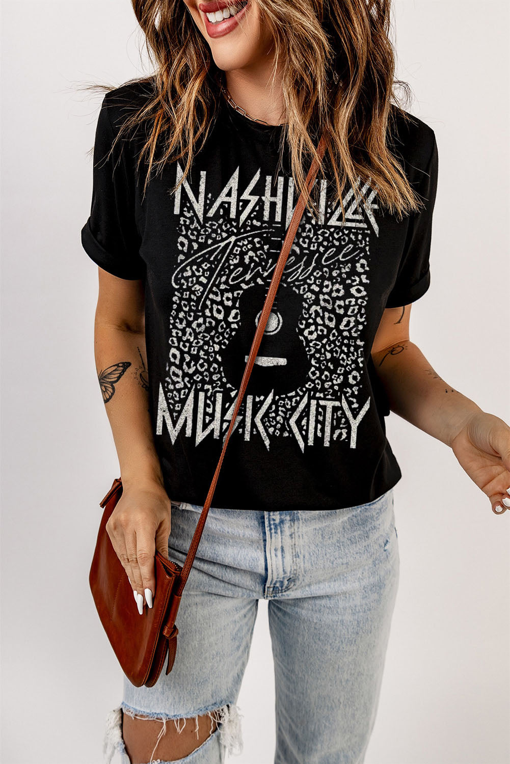 Black graphic tee with Nashville Music City print and leopard detail