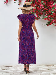 Emerald floral wrap midi dress with flutter sleeves and belted waist in Blue Purple.