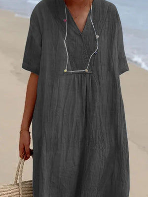Dark gray V-neck casual midi dress with short sleeves and textured fabric.