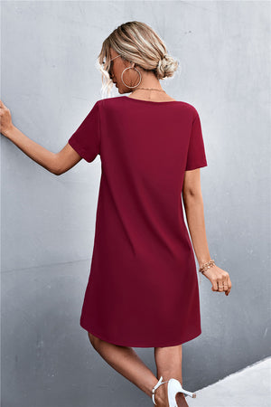 Wine V-neck shift dress with short sleeves and a relaxed fit.