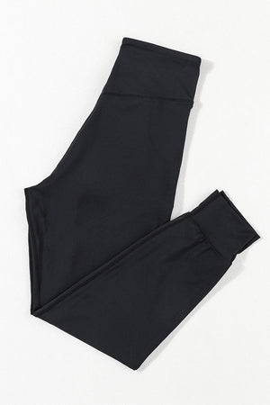 Black performance fit joggers with a comfortable waistband and cuffed ankles.