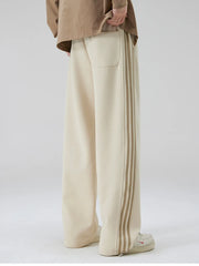 Men's khaki sweatpants with side stripe detail and back pocket.