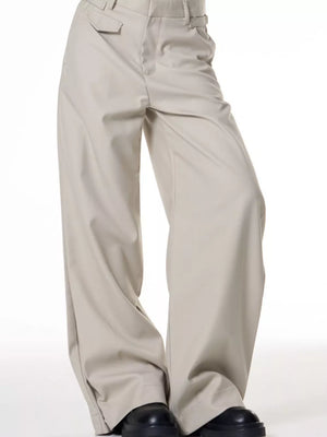 Men's light beige wide-leg cotton sweatpants with a relaxed fit and button closure.