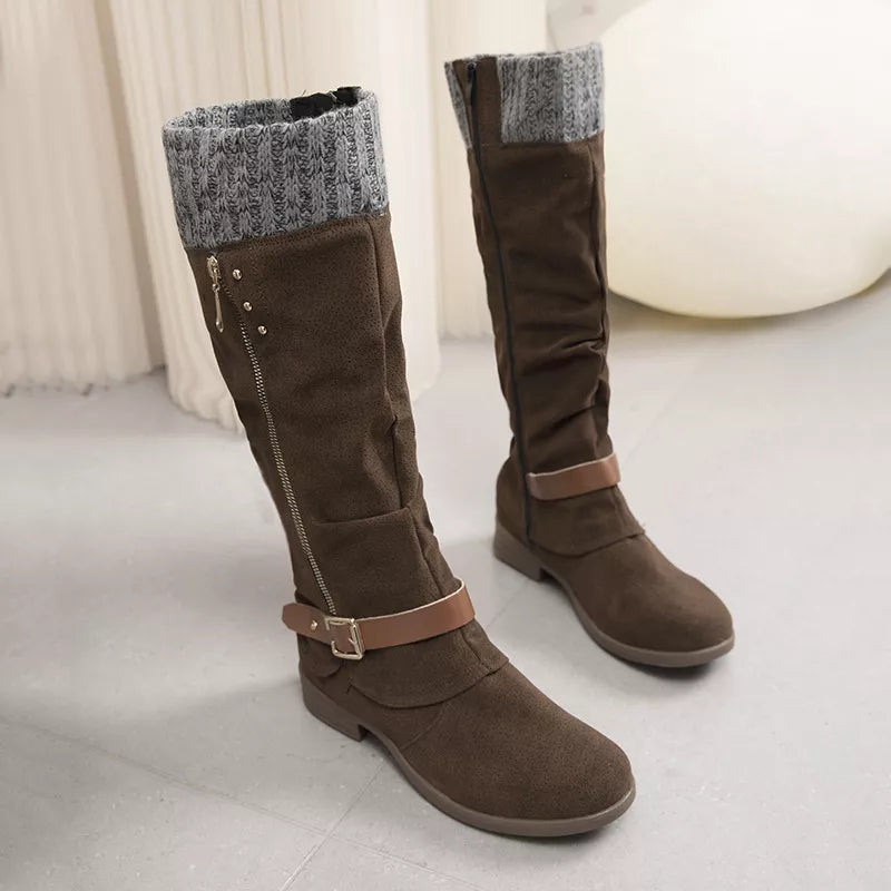 Brown suede knee-high slouch boots with grey knit detail and buckle strap.