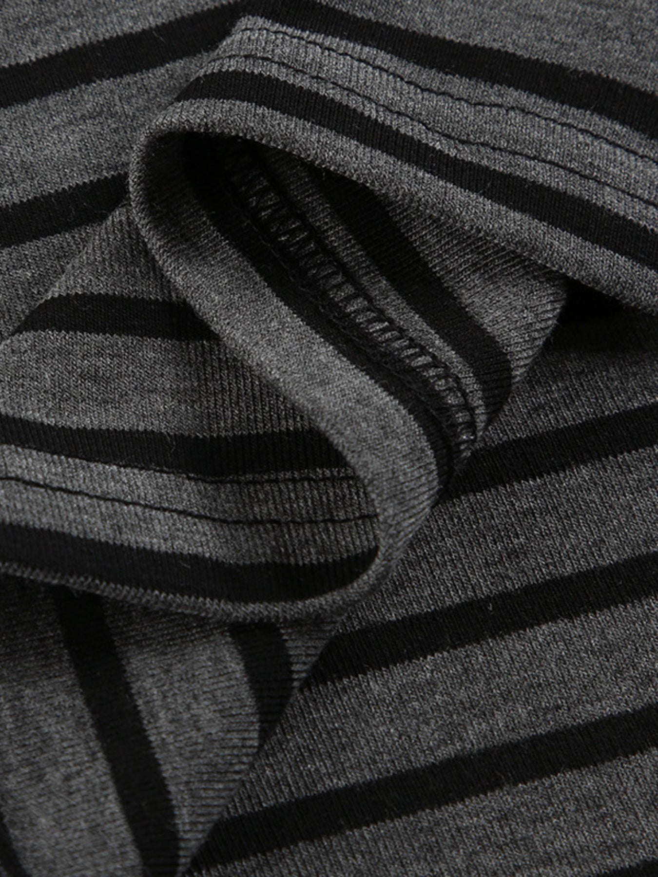 Grey and black striped t-shirt with a boat neck and comfortable stretch fabric.