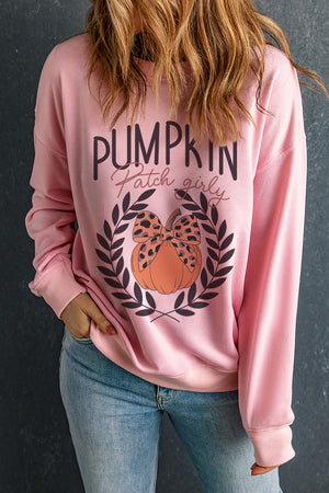 Blush pink graphic sweatshirt with pumpkin patch girly print and leopard bow detail.