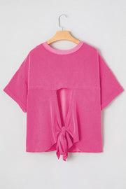 Bold ribbed backless maternity t-shirt in bright pink with a tie-front detail.