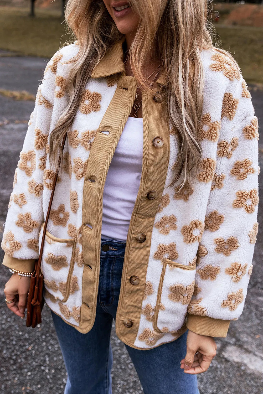 White sherpa jacket with floral pattern and corduroy trim, button front.