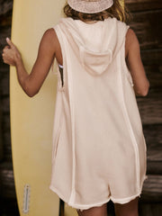 Sleeveless hooded romper in tan with raw edges and a relaxed fit.