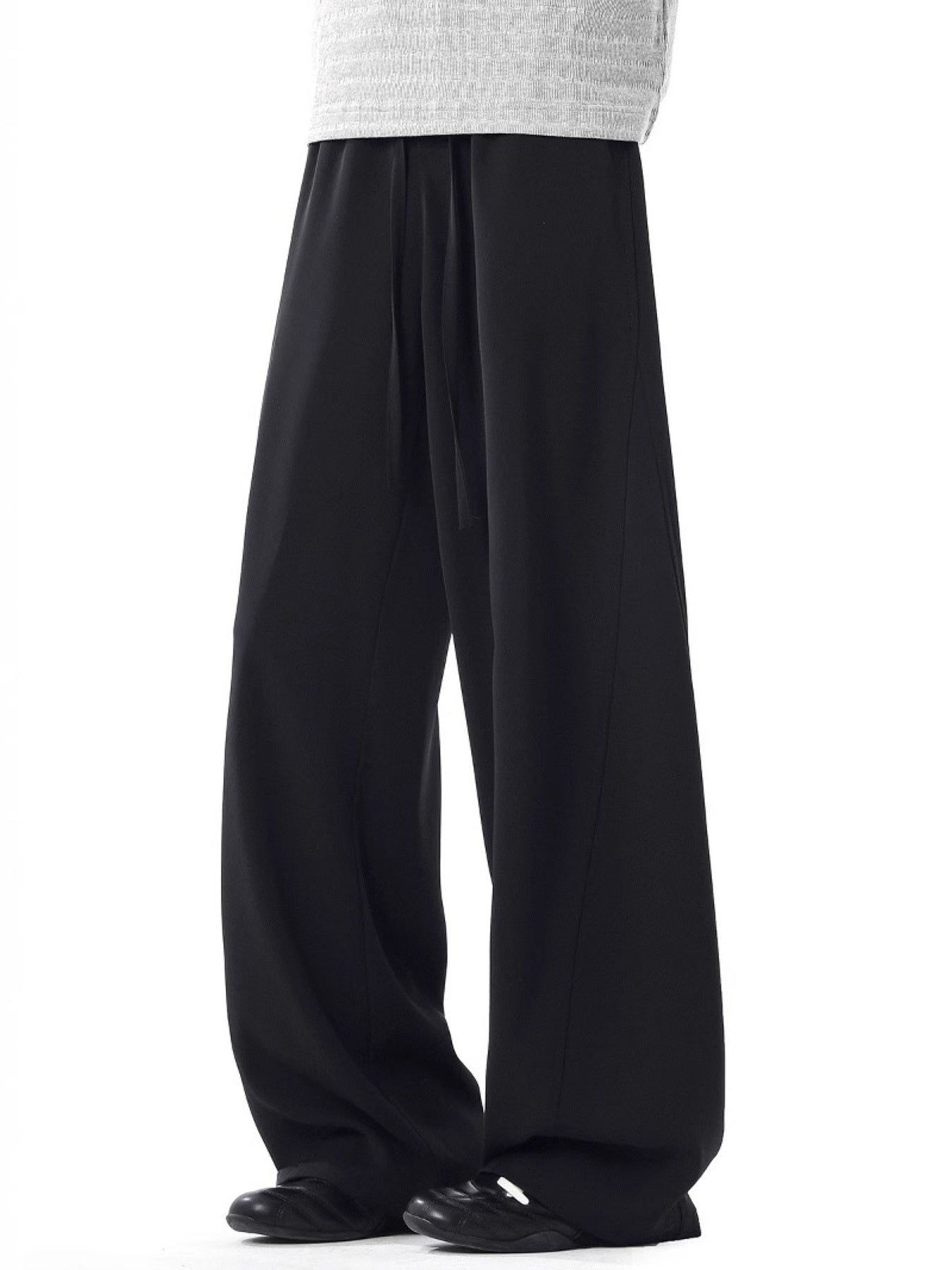 Men's black relaxed wide leg sweatpants with drawstring waist.