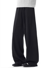 Men's black relaxed wide leg sweatpants with drawstring waist.
