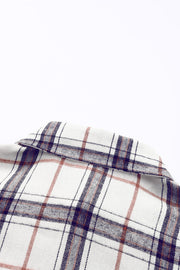 Oversized white shacket with a classic plaid pattern and collar detail.