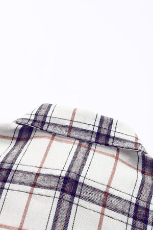Oversized white shacket with a classic plaid pattern and collar detail.