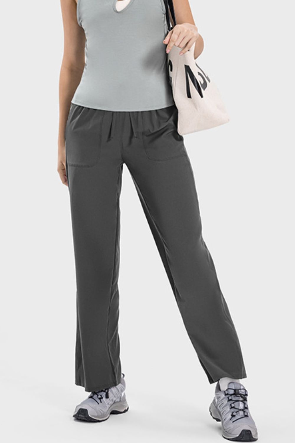 Charcoal relaxed drape drawstring palazzo pants with pockets and a wide leg.