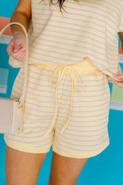 Pastel stripe relaxed shorts with drawstring waist and matching top.