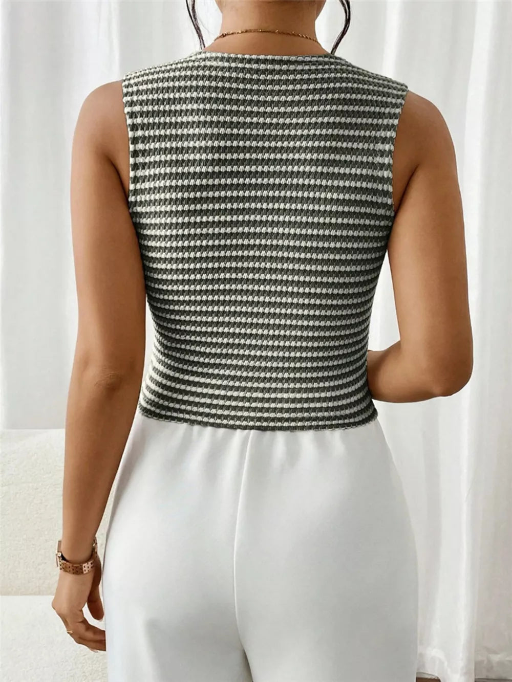 Chic striped knit V-neck tank top in khaki and white, sleeveless design.