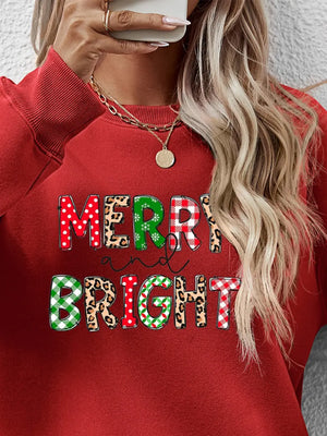 Deep Red crewneck sweatshirt with "Merry and Bright" graphic featuring plaid, leopard, and polka dot patterns.