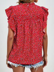 Red floral blouse with smocked yoke and ruffle sleeves.