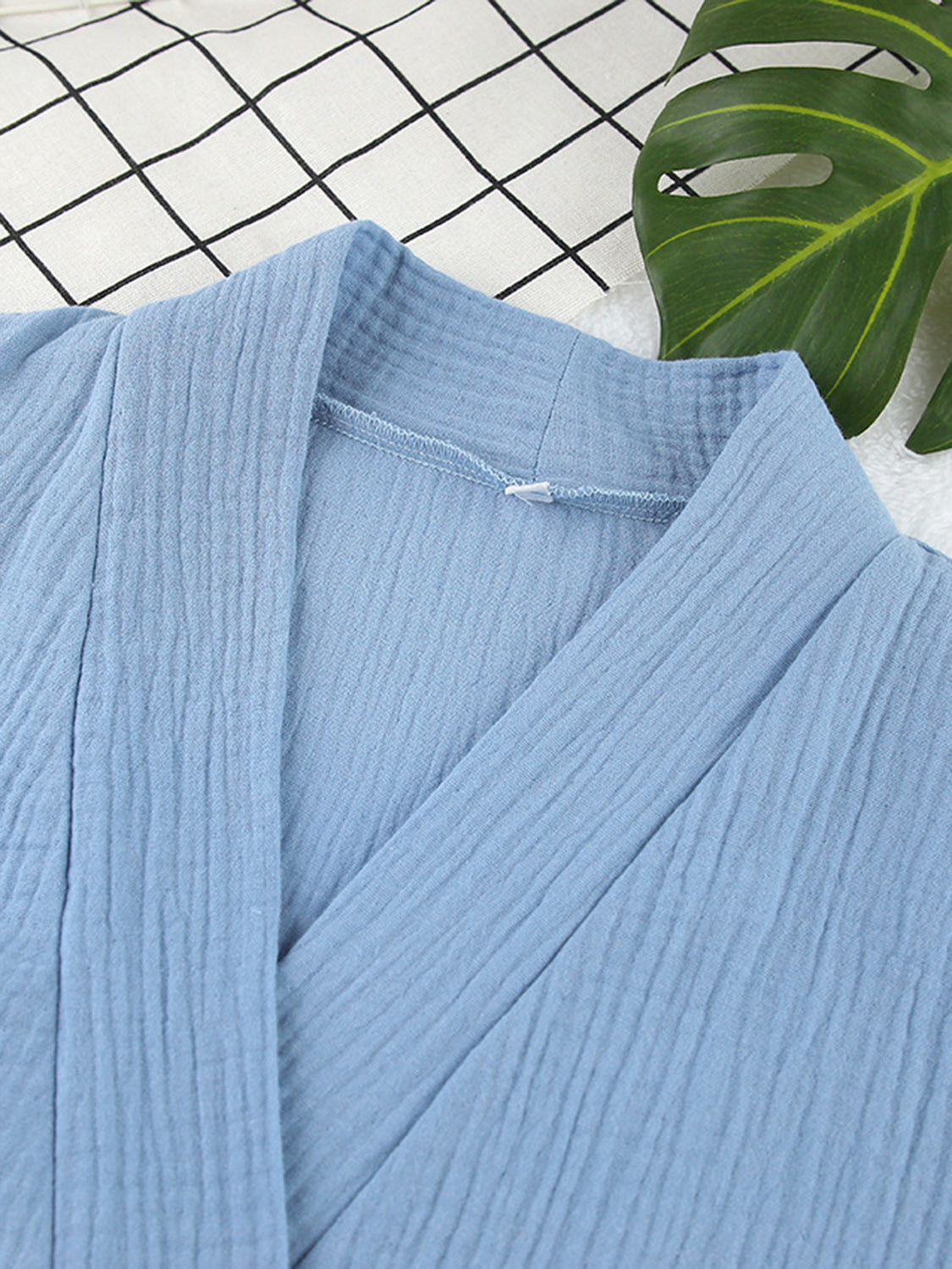 Light blue textured cotton kimono with a V-neckline and wrap front.