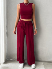 Burgundy ribbed crop top and wide-leg lounge pants with drawstring waist and front seams.