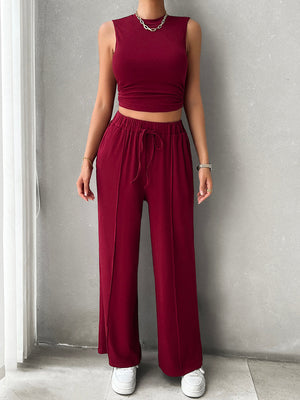 Burgundy ribbed crop top and wide-leg lounge pants with drawstring waist and front seams.