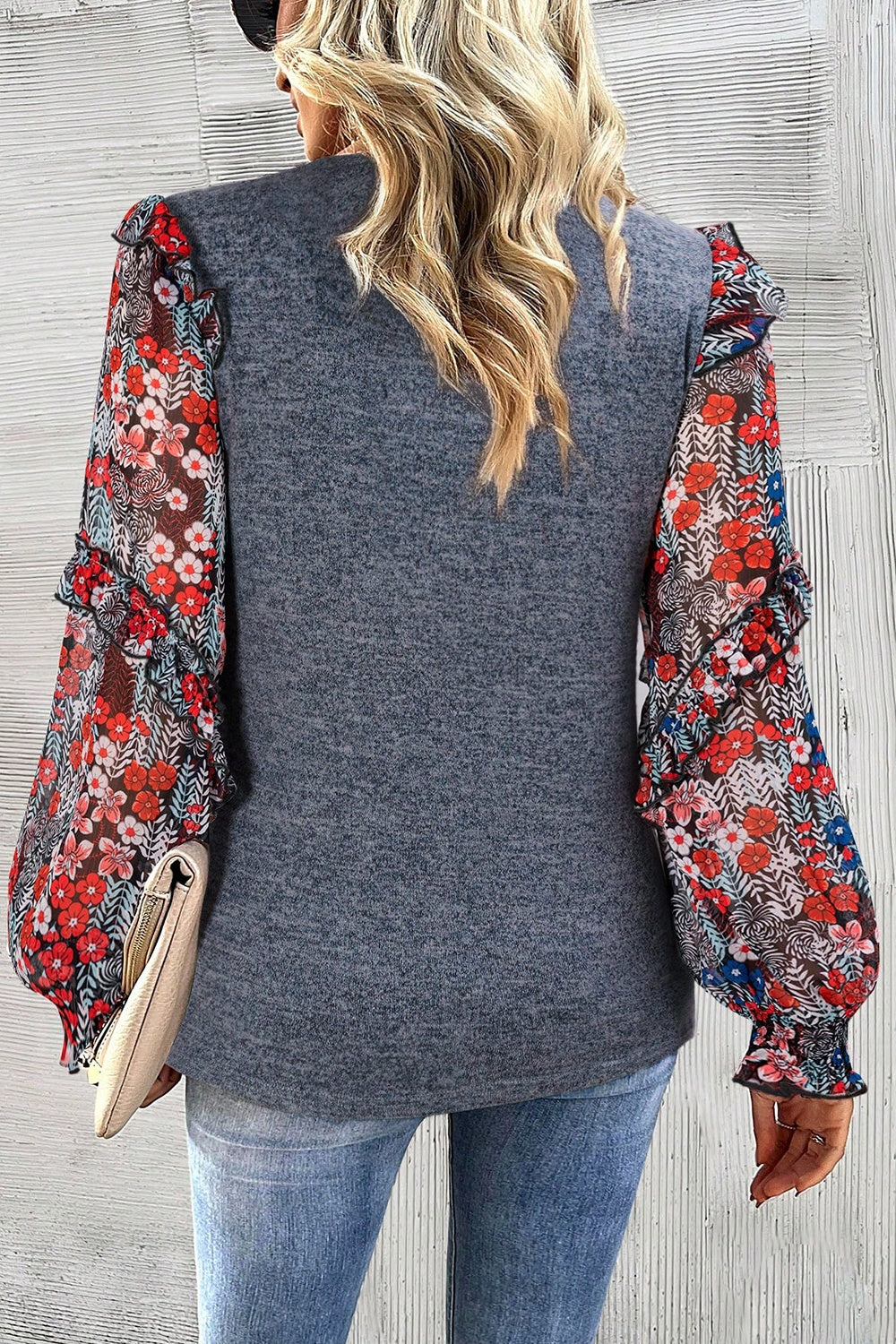 Dark gray knit blouse with floral chiffon balloon sleeves and ruffled cuffs.